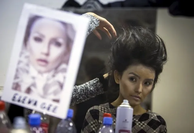 A model gets her hair done backstage during Kazakhstan Fashion Week in Almaty, Kazakhstan, October 14, 2015. (Photo by Shamil Zhumatov/Reuters)