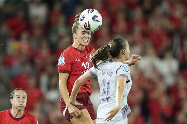 Switzerland's Lia Waelti heads the ball above Norway's Guro Reiten, right, during the Euro 2025, group A, soccer match between Switzerland and Norway at St. Jakob-Park in Basel, Switzerland, Wednesday, July 2, 2025. (Photo by Martin Meissner/AP Photo)