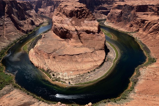 Horseshoe Bend is seen from a viewpoint in the Glen Canyon National Recreation Area near Page, Arizona, U.S. June 29, 2025. (Photo by Kaylee Greenlee/Reuters)