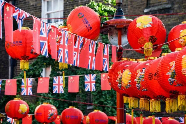The Union Jack flies alongside the Chinese flag in Chinatown on October 20, 2015 in London, England. (Photo by Chris Ratcliffe/Getty Images)