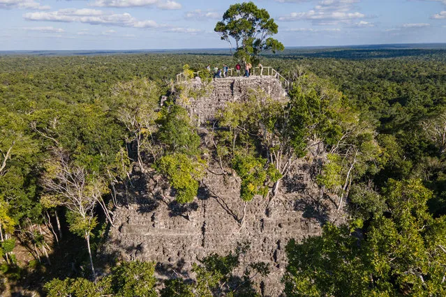 Areal view of La Danta pyramid at the El Mirador archaeological site in San Andres, Guatemala, on January 17, 2023. Among the vast green mantle of the jungle in northern Guatemala emerges the ridge of the Danta, one of the largest pyramids in the world located in the Mayan megacity El Mirador, an archaeological site that is rediscovered with technology. (Photo by Carlos Alonzo/AFP Photo)