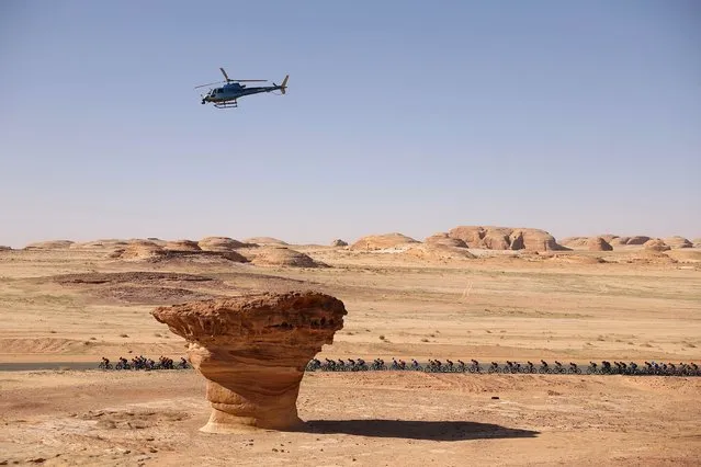 The pack rides during the second stage of 2023 Saudi Tour, from Winter Park to Shalal Sijlyat Rocks, on January 31, 2023. (Photo by Thomas Samson/AFP Photo)