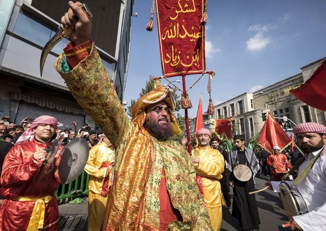 Actors take part in a re-enactment of the 7th century battle of Kerbala during the "Taziyeh" religious theatre performance on Ashura, near Tehran's grand bazaar October 24, 2015. Ashura, which falls on the 10th day of the Islamic month of Muharram, commemorates the death of Imam Hussein, grandson of Prophet Mohammad, who was killed in the 7th century battle of Kerbala. (Photo by Raheb Homavandi/Reuters)