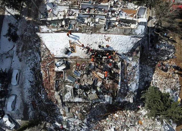 An aerial view taken with a drone shows a collapsed building as rescue works continue in the aftermath of a major earthquake in the Besni district of Adiyaman city, Turkey, 08 February 2023. More than 11,000 people have died and thousands more injured after two major earthquakes struck southern Turkey and northern Syria on 06 February. Authorities fear the death toll will keep climbing as rescuers look for survivors across the region. (Photo by Necati Savas/EPA/EFE/Rex Features/Shutterstock)