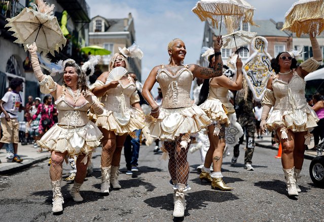 Members of the Mahogany Blue Baby Dolls including Victoria “Lady Lotus” Spotts (C) march in the 25th Anniversary Satchmo Salute second line parade, honoring New Orleans jazz legend Louis Armstrong, on August 3, 2025 in New Orleans, Louisiana. Revelers marched from historic St. Augustine Catholic Church in the Tremé neighborhood to the New Orleans Jazz Museum where Satchmo Summerfest is being held. New Orleans and the Gulf Coast region are preparing to mark the 20 year anniversary of Hurricane Katrina, which occurred on August 29, 2005. The failure of levees during the catastrophic storm in New Orleans flooded about 80 percent of the city including historic communities such as the Lower Ninth Ward. Katrina resulted in nearly 1,400 deaths, according to revised statistics from the National Hurricane Center, and remains the costliest storm in U.S. history at around $200 billion in today’s dollars. (Photo by Mario Tama/Getty Images)