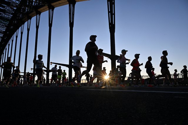 Athletes cross the Harbour Bridge during the 2025 Sydney Marathon on August 31, 2025. (Photo by Saeed Khan/AFP Photo)