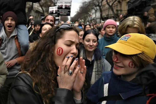 People shout slogans during a march, marking the 175th anniversary of a failed 1848 uprising, in Budapest, Hungary, Wednesday, March 15, 2023. A “freedom march” was organized by dozens of civic organizations who are calling for greater social solidarity and an end to what they call intimidation from Viktor Orban's government. (Photo by Denes Erdos/AP Photo)