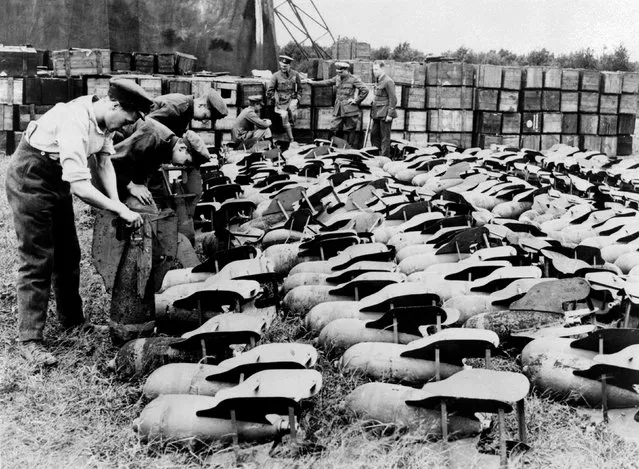 Armourers prepare the full complement of 112lb bombs needed for night bombing operations by the FE2bs of 149 Squadron at Saint-Omer, France, 1918. (Photo by Air Historical Branch/RAF/PA Wire)
