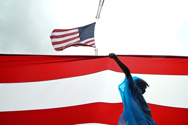 Brooklyn College Veterans Students’ Organization members carry an oversized American during the National Memorial Day Parade on Monday May 27, 2024 in Washington, DC. Many events took place in the area honoring the holiday. (Photo by Matt McClain/The Washington Post)
