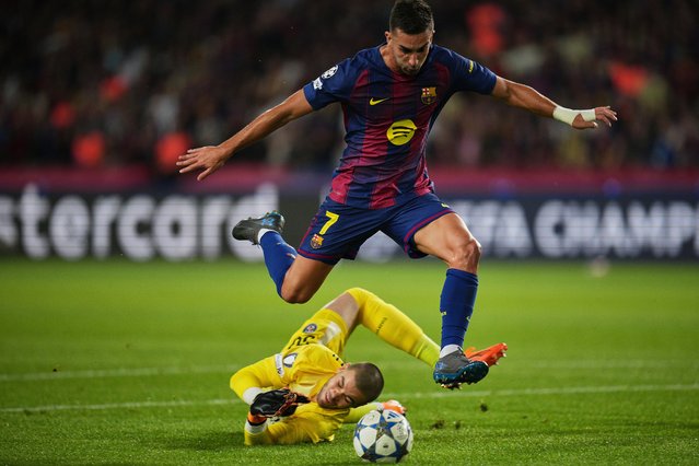 PSG's goalkeeper Lucas Chevalier fails to stop Barcelona's Ferran Torres during the Champions League opening phase soccer match between Barcelona and Paris Saint-Germain at the Lluis Companys Olympic Stadium in Barcelona, Spain, Wednesday, October 1, 2025. (Photo by Emilio Morenatti/AP Photo)