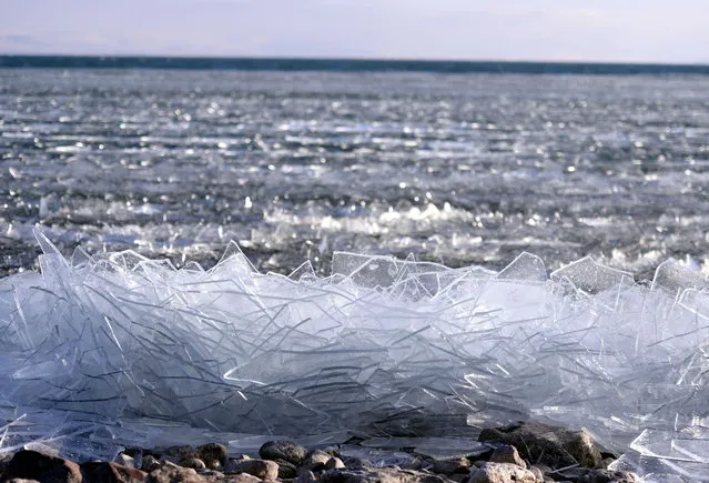 A view of broken ice pieces are seen after heavy winds' effect the waves on Cildir Lake in Ardahan, Turkey on December 19, 2020. (Photo by Gunay Nuh/Anadolu Agency via Getty Images)