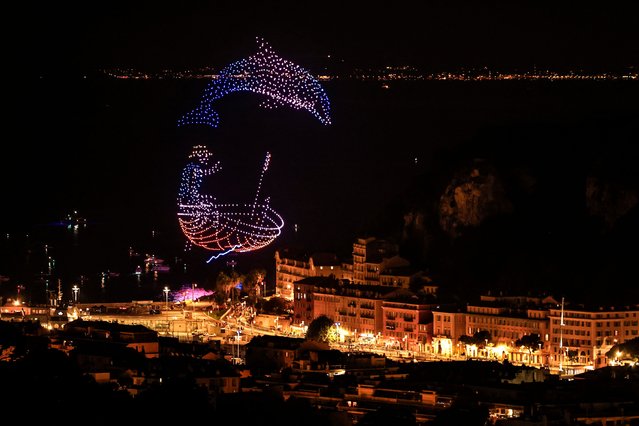 This photograph shows a drone light show to celebrate the arrival of the 111th edition of the Tour de France cycling race in Nice, southeastern France, on July 20, 2024. The final stage of the 2024 Tour de France takes place in the french riviera city of Niceon July 21, 2024, due to the Olympics in the French capital. (Photo by Valéry Hache/AFP Photo)