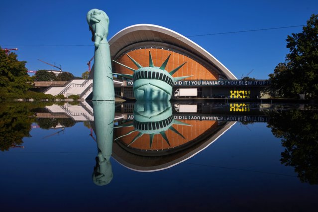 An inflatable Statue of Liberty floats in a pool outside the Haus der Kulturen der Welt museum as part of the exhibition Possibility of Unvernunft (Die Möglichkeit der Unvernunft) by satirist Jan Boehmermann and the artist collective Gruppe Royale, in Berlin, Germany, Thursday, October 2, 2025. (Photo by Markus Schreiber/AP Photo)