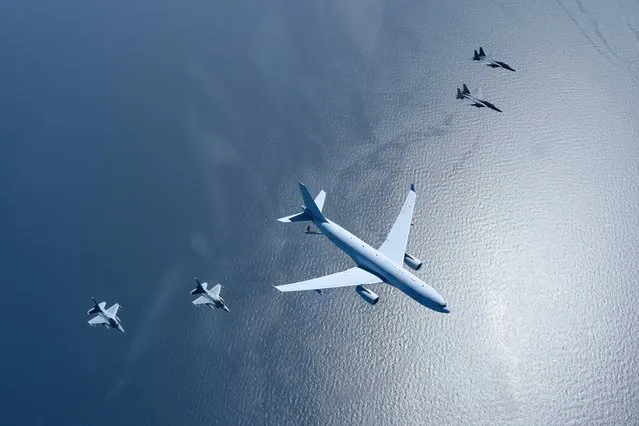 A handout photo made available by South Korean Air Force shows a KC-330 aerial tanker (C) of the South Korean Air Force flying along with F-15K and KF-16 jet fighters in an air-to-air refueling drill on April 12, 2023. (Photo by South Korean Air Force/Yonhap via EPA)