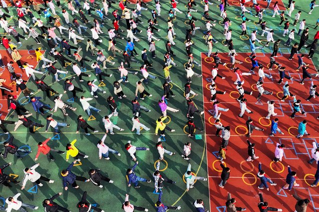 Primary school students take part in a physical education class at a school in Lianyungang, eastern China's Jiangsu Province, on November 20, 2025. (Photo by AFP Photo/China Stringer Network)