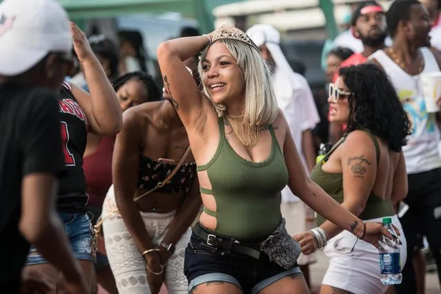 A woman dances during Black Bike Week on May 27, 2018 in Atlantic Beach, South Carolina. Also known as Atlantic Beach Bikefest and Black Bikers Week, the annual Memorial Day weekend event has been held since 1980. (Photo by Sean Rayford/The Sun)