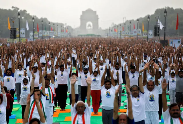 People perform yoga at India Gate on International Yoga Day in New Delhi, India on June 21, 2018. (Photo by Saumya Khandelwal/Reuters)