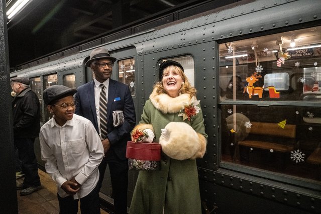 People wearing period clothing participate in the annual vintage subway train ride on December 8, 2024 in New York City. The yearly tradition of Holiday Nostalgia Rides, in its 20th year and hosted by the New York Transit Museum, puts into operation 1930 R1/9 train cars between 2nd Avenue and Houston Street on the uptown F line, and 96th Street and 2nd Avenue on the Q line. (Photo by Stephanie Keith/Getty Images)