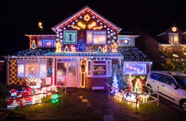 Christmas lights are displayed on houses in Trinity Close in Burnham-on-Sea on December 14, 2015 in Somerset, England. Each year a number of house in the close put on a display of thousands of festive lights which raises tens of thousands of pounds for various charities including local cancer hospital and will be lit every night until January 5. (Photo by Matt Cardy/Getty Images)