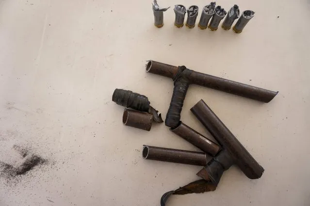 Seized weapons are seen after being destroyed by the authorities of the General Directive for the Control of Weapons and Munitions, (DIGECAM), in Guatemala City, December 17, 2015. (Photo by Jorge Dan Lopez/Reuters)