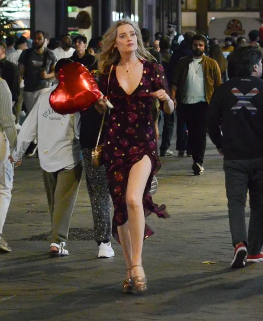 Irish media personality and model Laura Whitmore is seen carrying a heart shaped balloon whilst walking across Leicester Square to catch the tube home after a night out at Lio of London in Soho on June 17, 2023. (Photo by GAT/GoffPhotos.com)
