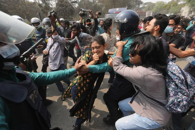 Bangladeshi students clash with police during a protest in Dhaka, Bangladesh, Monday, March 1, 2021. About 300 student activists rallied in Bangladesh's capital on Monday to denounce the death in prison of Mushtaq Ahmed, a writer and commentator who was arrested last year on charges of violating a sweeping digital security law that critics say chokes freedom of expression. (Photo by Mahmud Hossain Opu/AP Photo)