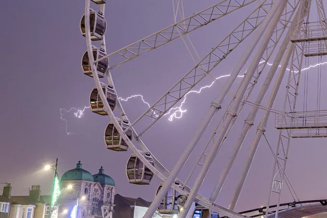 Picture dated September 8th, 2022 shows lightning striking Great Yarmouth Big Wheel in Norfolk at 2am this morning. (Photo by Steven Hardiman/Bav Media)