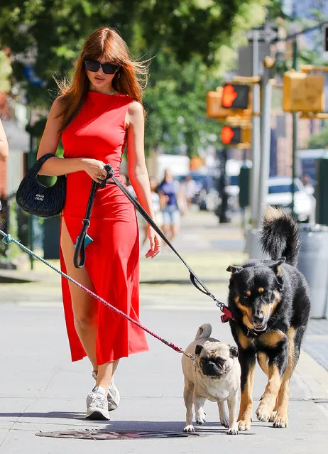 American model Emily Ratajkowski wore a cut out red dress while taking her dog Colombo for a stroll in New York City on Friday, July 25, 2023. (Photo by Santi/Splash News and Pictures)