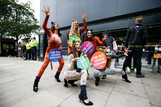 Demonstrators pose outside the BFC Showspace where London Fashion Week Women's is held, in London, Britain September 14, 2018. (Photo by Henry Nicholls/Reuters)
