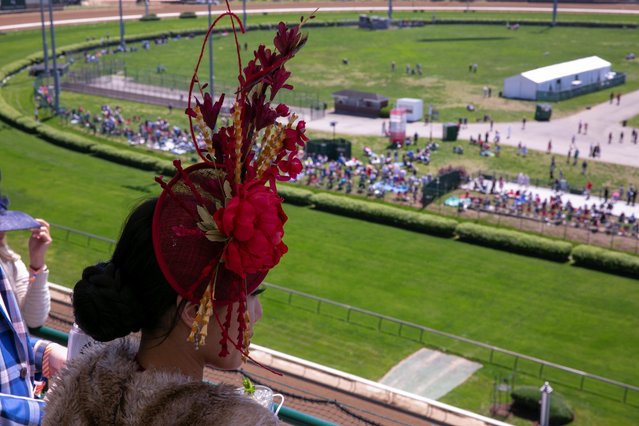 A spectator enjoys the day of the 147th Kentucky Derby at Churchill Downs in Louisville, Kentucky, U.S. May 1, 2021. (Photo by Amira Karaoud/Reuters)