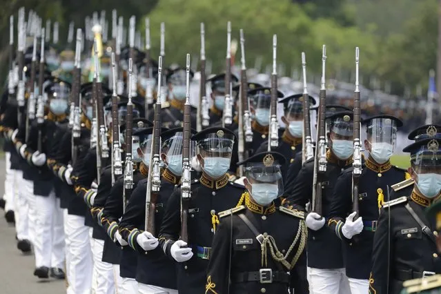 Honor guards march during the state burial rites of former Philippine President Benigno Aquino III on Saturday, June 26, 2021 at a memorial park in suburban Paranaque city, Philippines. (Photo by Aaron Favila/AP Photo)
