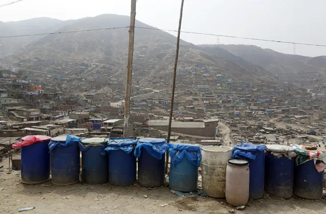 Containers used to collect water are seen at Pamplona Alta shanty town in San Juan de Miraflores district of Lima, Peru, March 10, 2015. (Photo by Mariana Bazo/Reuters)
