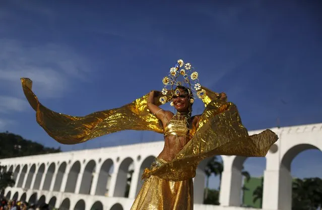 A reveller takes part in an annual block party known as “Cordao do Boitata”, one of the many carnival parties to take place in the neighbourhoods of Rio de Janeiro January 31, 2016. (Photo by Pilar Olivares/Reuters)