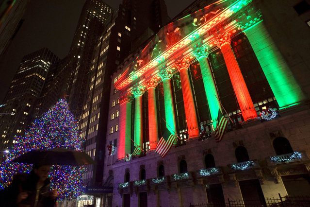 This photo shows the exterior of the New York Stock Exchange on Thursday evening, December 20, 2018. Stocks went into another slide Thursday in what is shaping up as the worst December on Wall Street since the depths of the Great Depression, with prices dragged down by rising fears of a recession somewhere on the horizon. The Dow Jones Industrial Average dropped 464 points, bringing its losses to more than 1,700 since last Friday. (Photo by Patrick Sison/AP Photo)