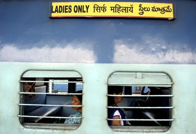 Indian passengers sit in a “Ladies Only” carriage as they wait for a train to depart from a platform at Secunderabad Railway Station in Hyderabad on February 25, 2016, as Indian Railways Minister Suresh Prabhu presents The Railway Budget at Parliament House in New Delhi. (Photo by Noah Seelam/AFP Photo)