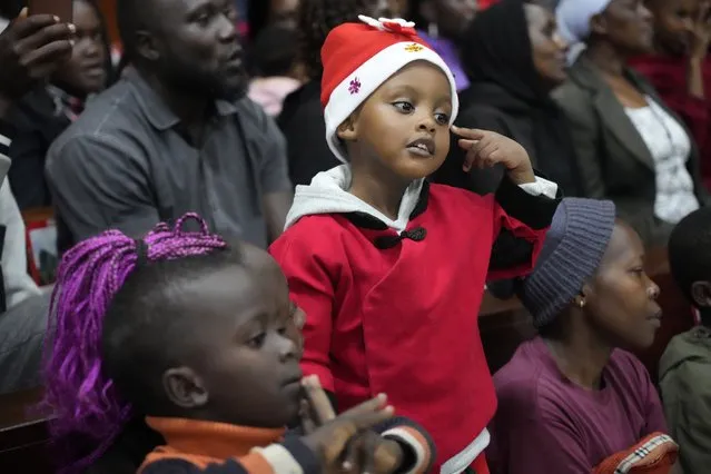 A child attends Mass at Our Lady of Mercy Catholic Church in Nairobi, Kenya, Sunday, December 24, 2023. (Photo by Sayyid Abdul Azim/AP Photo)