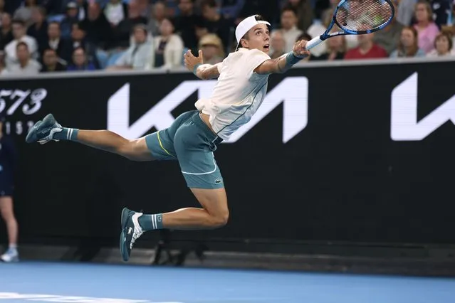 Arthur Cazaux of France plays a backhand return to Holger Rune of Denmark during their second round match at the Australian Open tennis championships at Melbourne Park, Melbourne, Australia, Thursday, January 18, 2024. (Photo by Asanka Brendon Ratnayake/AP Photo)