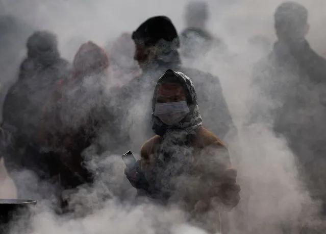 Smoke rises from the burning of incense offered by devotees at Boudhanath Stupa, a UNESCO world heritage site, in Kathmandu, Nepal on January 22, 2024. (Photo by Navesh Chitrakar/Reuters)