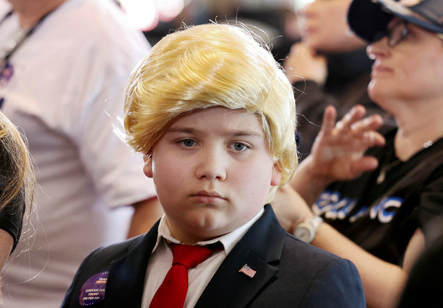 Shayne Skougard, 11, of Las Vegas waits with his family for Republican presidential candidate and former U.S. President Donald Trump to speak at a campaign rally ahead of the Republican caucus in Las Vegas, Nevada, U.S. January 27, 2024. (Photo by Ronda Churchill/Reuters)