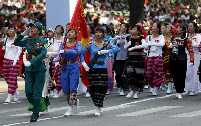 Female members of the ethnic minorities militia force march during a military parade as part of the 40th anniversary of the fall of Saigon in Ho Chi Minh City, April 30, 2015. (Photo by Reuters/Kham)