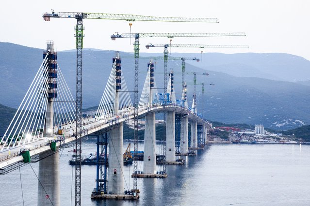 A view of the construction of the Peljesac Bridge in Komarna, Croatia, Wednesday, July 28, 2021. European Union-funded Peljesac Bridge in southern Croatia that has been built by a Chinese state-owned company was opened late Wednesday. The bridge was designed to connect two swaths of Adriatic Sea coastline and passes over a small stretch of Bosnia's territorySeptember 27, 2020. (Photo by AP Photo/Stringer)