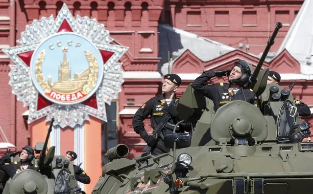 Russian servicemen drive armoured personnel carriers (APC) during a rehearsal for the Victory Day parade in Red Square in central Moscow, Russia, May 7, 2015. (Photo by Grigory Dukor/Reuters)