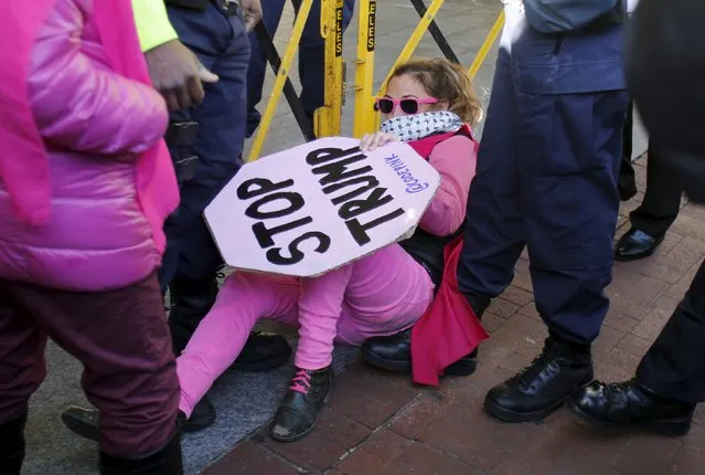 A Code Pink activist breaks a police line during an anti-Trump rally outside during the American-Israeli Public Affairs Committee (AIPAC) Conference at the Verizon Center in Washington March 21, 2016. (Photo by Yuri Gripas/Reuters)
