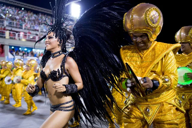Queen of Percussion Mariana Rios and members of Mocidade Samba School during its parade at 2014 Brazilian Carnival at Sapucai Sambadrome on March 03, 2014 in Rio de Janeiro, Brazil. (Photo by Buda Mendes/Getty Images)