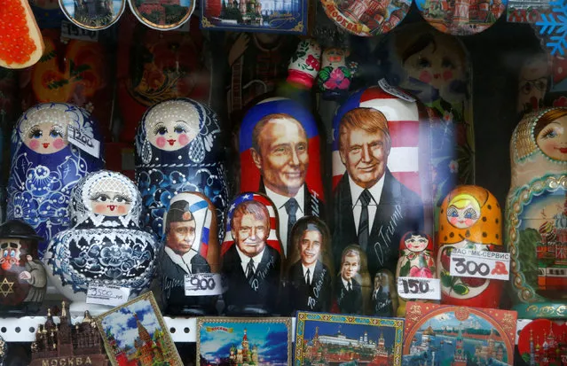Russian traditional Matryoshka wooden dolls with images of Russian President Vladimir Putin, U.S. President Donald Trump and his predecessors are on sale at a gift kiosk in a street in Moscow, Russia February 22, 2017. (Photo by Sergei Karpukhin/Reuters)