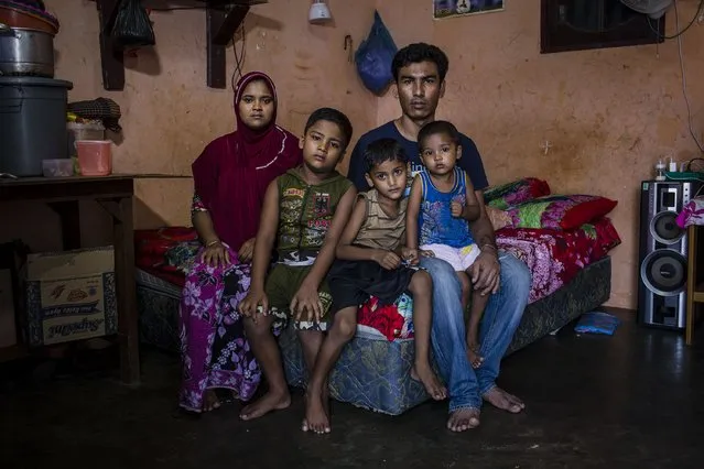 A Rohingya refugee family Muhammad Shofialam (31), and his wife Mazumakatuh (26) with their children, pose for photograph inside of their refugee camp on February 12, 2017 in Medan, North Sumatra, Indonesia. Muhammad Shofialam, have been in refugee camp for six years and are not able to legally work while waiting for registration and resettlement. (Photo by Ulet Ifansasti/Getty Images)