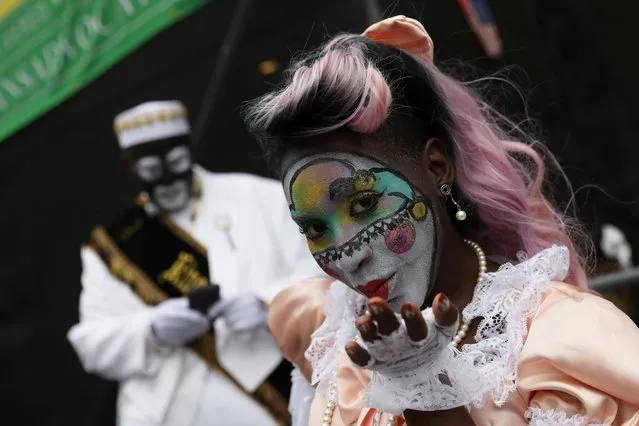 A member of the New Orleans Baby Doll Ladies blows a kiss during the Krewe of Zulu parade at Mardi Gras in New Orleans, Louisiana U.S., February 28, 2017. (Photo by Shannon Stapleton/Reuters)