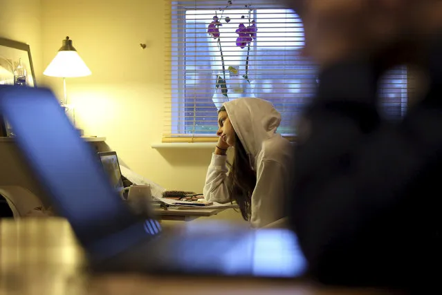 14-year old student Isla Stanton, begins her home school lesson via a video link, in Ashford, south England, Tuesday January 5, 2021, following new lockdown measures to limit the coronavirus including the closure of schools. The lockdown and home schooling has become a major issue, highlighting the wealth divide with provision of internet connectivity, equipment issues and the impact on upcoming school exams. Prime Minister Boris Johnson has set out further measures including closure of schools as part of a seven week lockdown period in a bid to halt the spread of the coronavirus.(Photo by Gareth Fuller/PA Wire via AP Photo)
