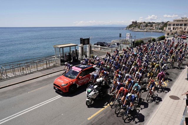The peloton of cyclists ride along the coastline during the fifth stage of the Giro d’Italia, or Tour of Italy, cycling race, from Genoa to Lucca on May 8, 2024. (Photo by Fabio Ferrari/AP Photo)