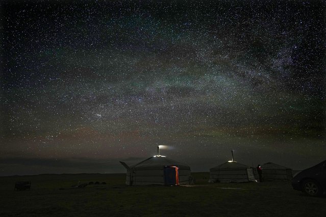 Stars light up the night sky over Lkhaebum's ger, a portable, round tent insulated with sheepskin, in the remote Munkh-Khaan region of the Sukhbaatar district, in southeast Mongolia, Tuesday, May 16, 2023. (Photo by Manish Swarup/AP Photo)